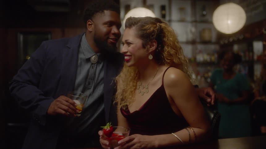 Man and woman flirt in a bar