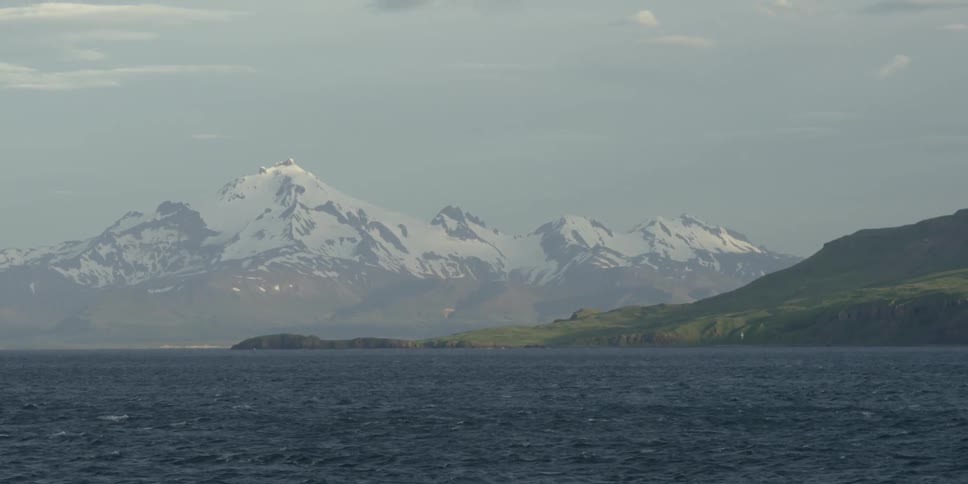Mountain peaks beyond the ocean