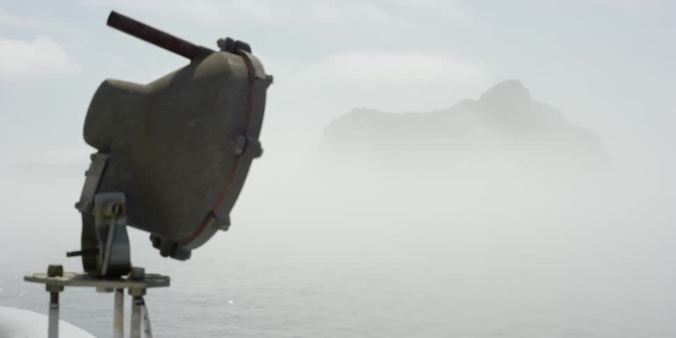 A boat light on a foggy day