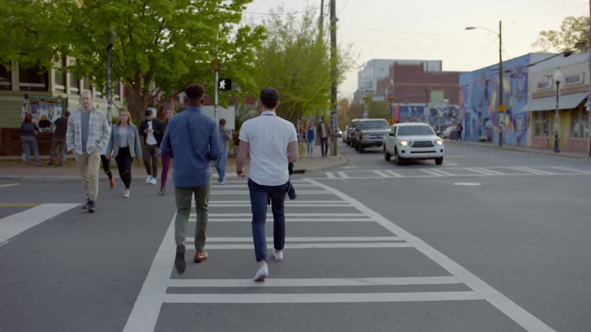 Pedestrians cross a city street