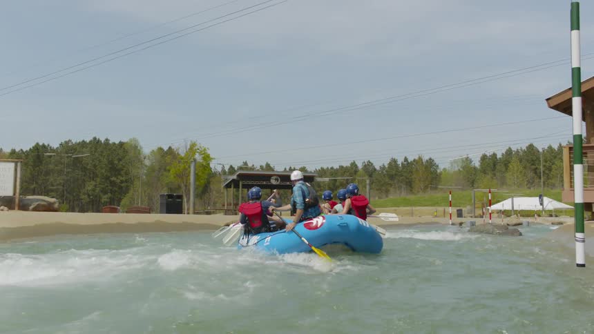 People raft on a river