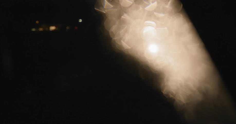 A person walks in front of a light