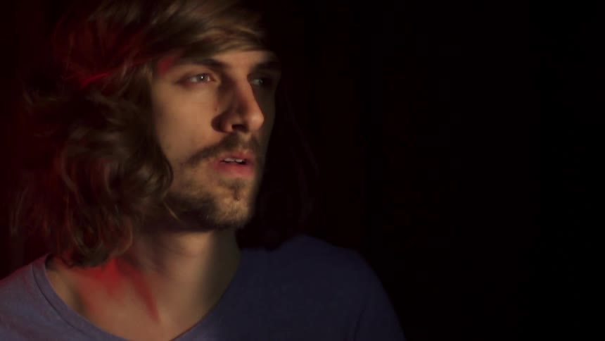 Man looks off into the distance at night