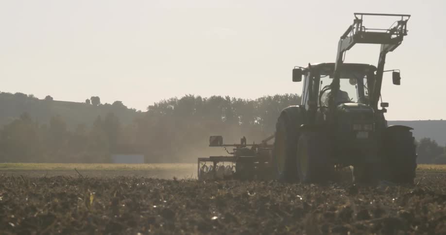 The tractor is working the field