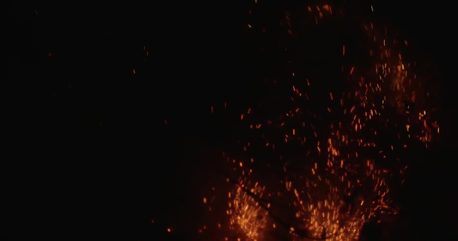 Man pours water on a burning fire