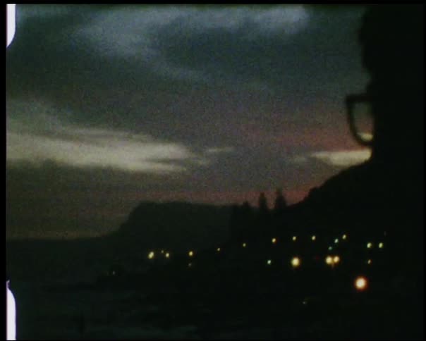 A person looks out over the dawn view
