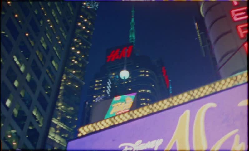 A broadway sign in a city at night