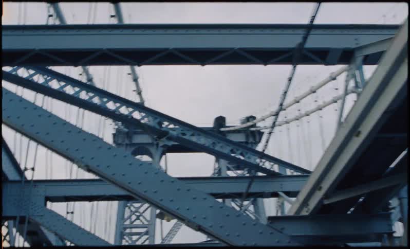 Metal beams support a city bridge
