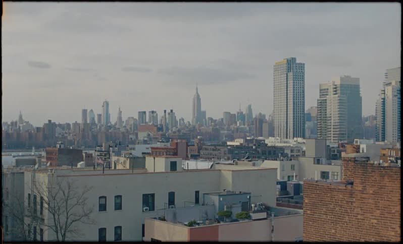 Tall city buildings tower into the sky