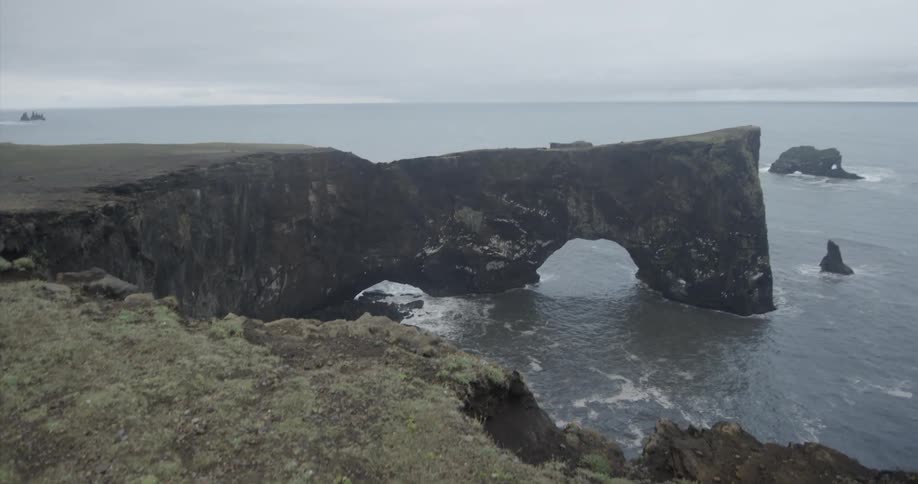 A rocky cliff near an ocean