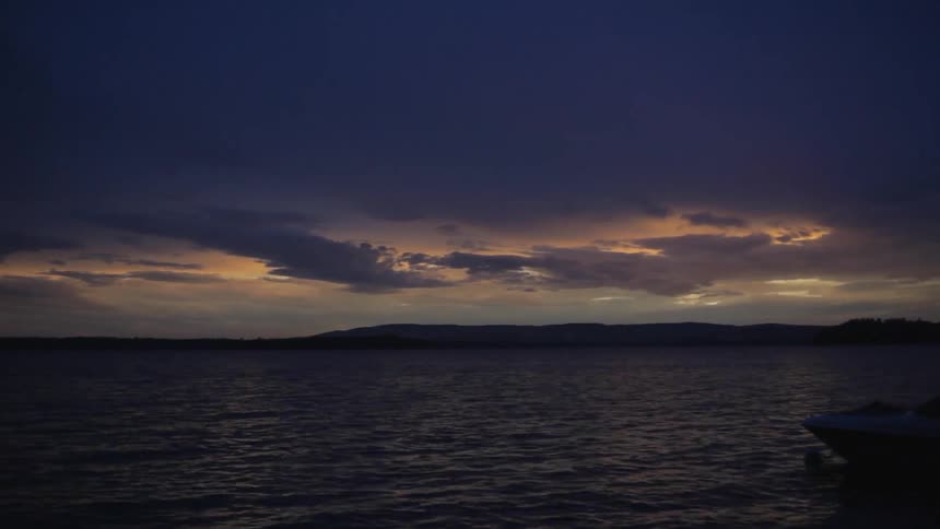 A body of water at sunset