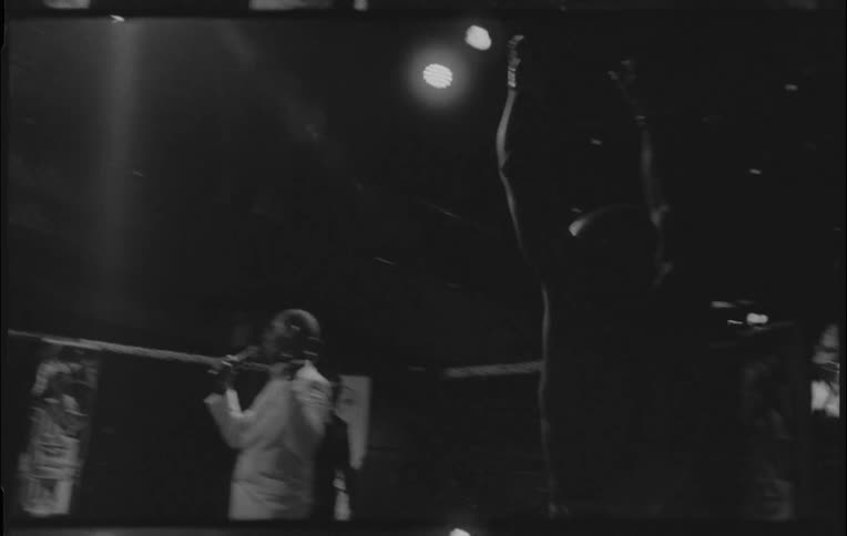 A man prepares to fight in an octagon cage