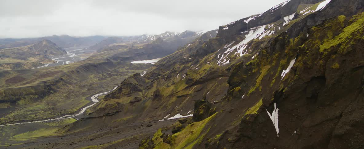 Green mountains dusted with snow