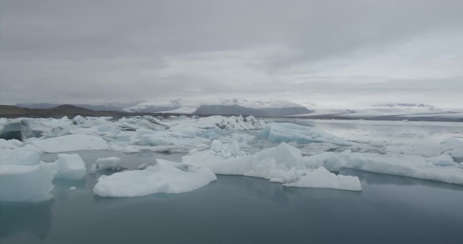 Chunks of ice float on a mountain lake