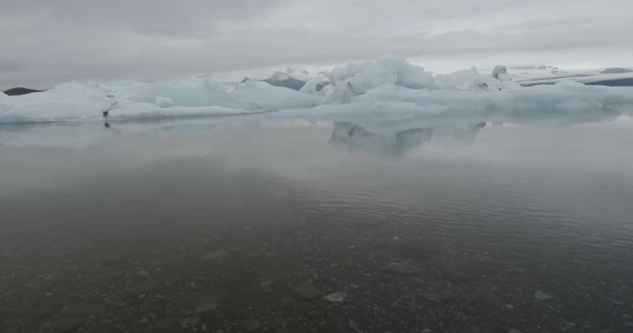A glacier near a pond