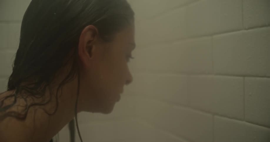 A woman takes a steamy shower