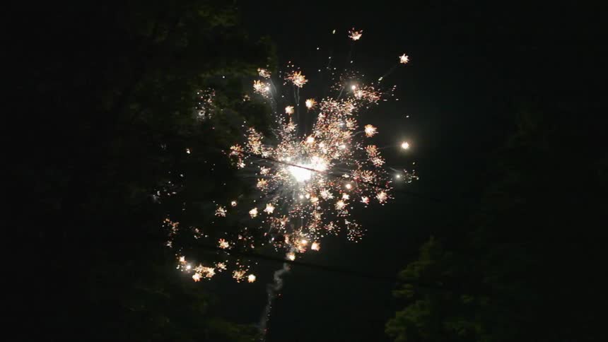 A firework is exploding in the night sky