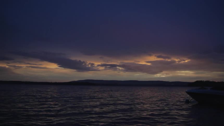 The tide flows towards the shore at dusk