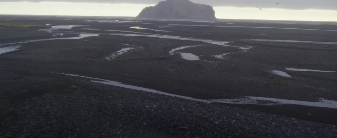 Streams of water and a large rock formation