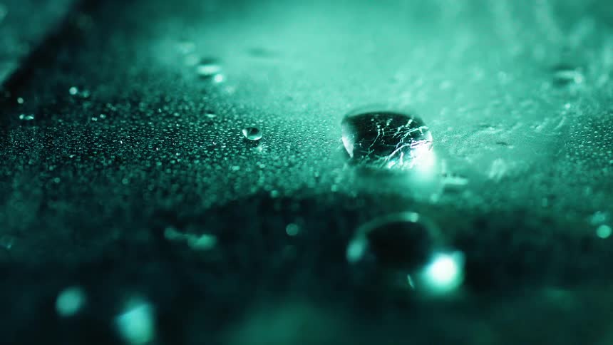 Light reflects on beads of water