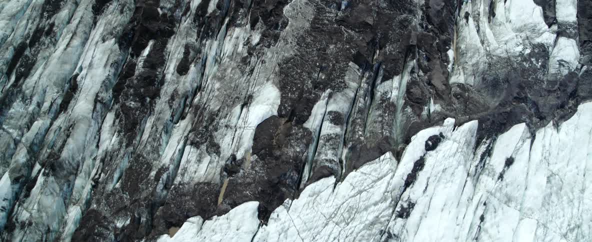 Snow and ice cover a mountain