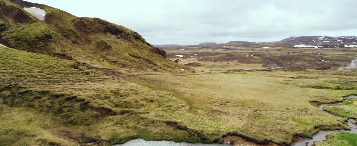 Hills surround a small lake