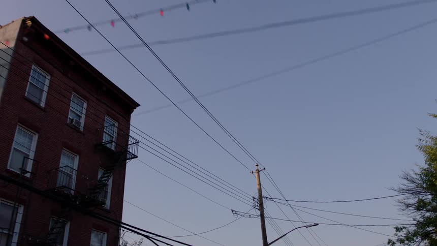 A neighborhood is covered in power lines