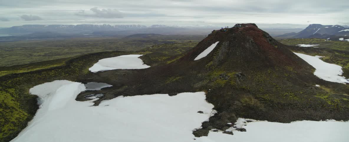 People are on top of the mountain