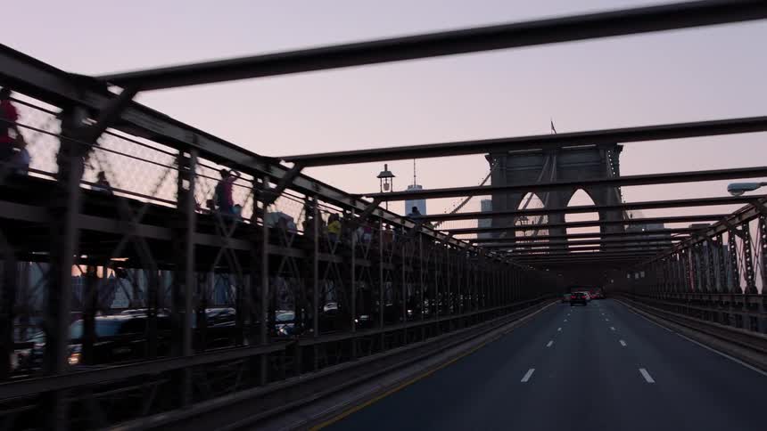 Vehicles travel over a city bridge