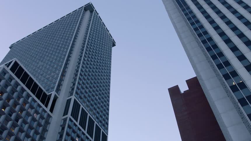 Tall city buildings tower into the sky