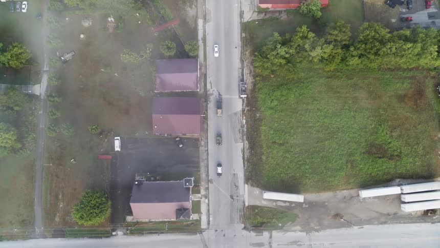 Cars drive on a town road