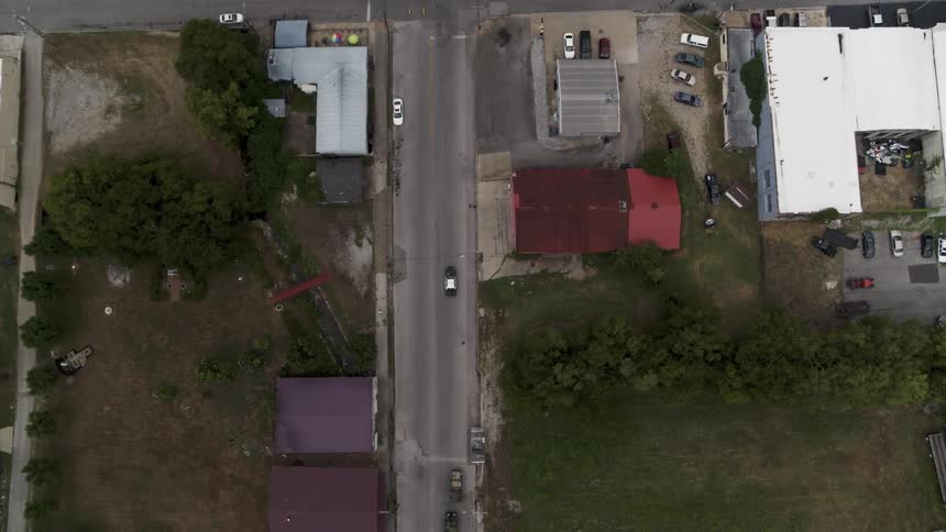 A car drives on a town street