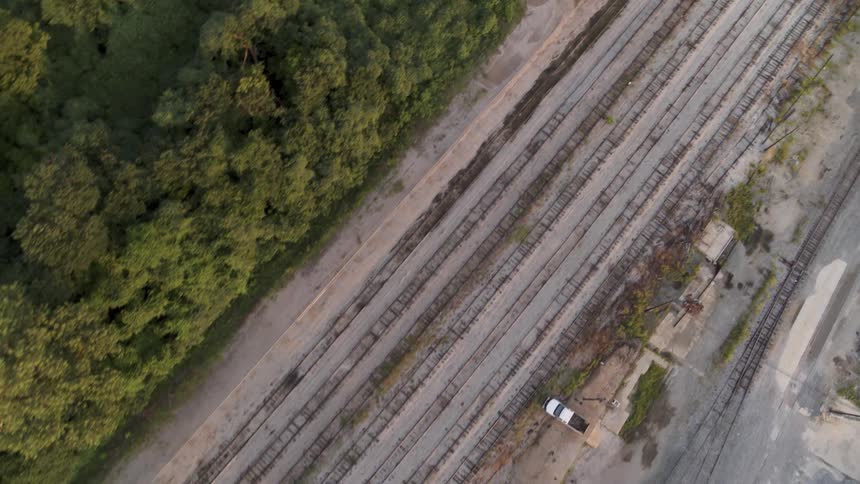 Train tracks cover a rural landscape