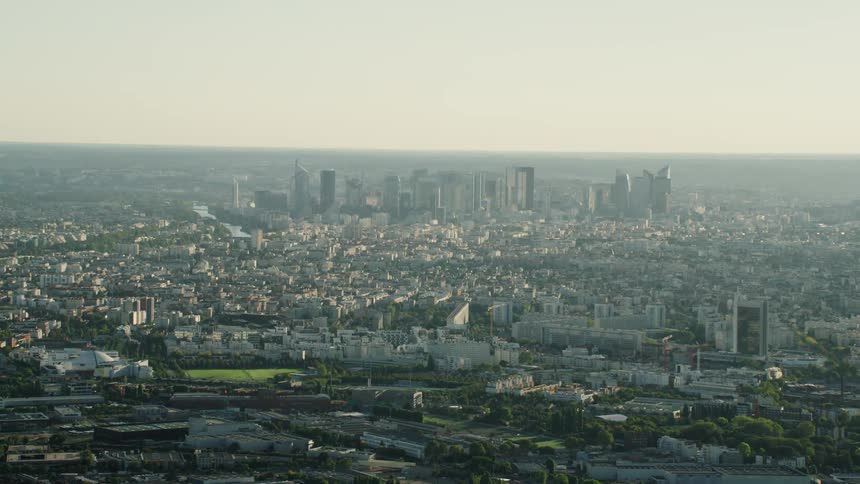 City buildings cover the ground on a hazy day