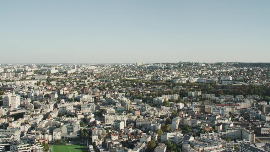 City buildings cover the ground on a clear day