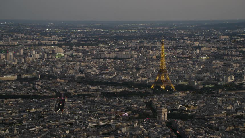The eiffel tower lit up at night