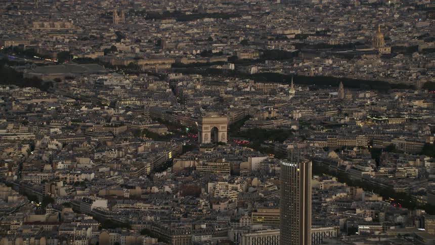 Traffic travels around the Arc de triomphe in Paris