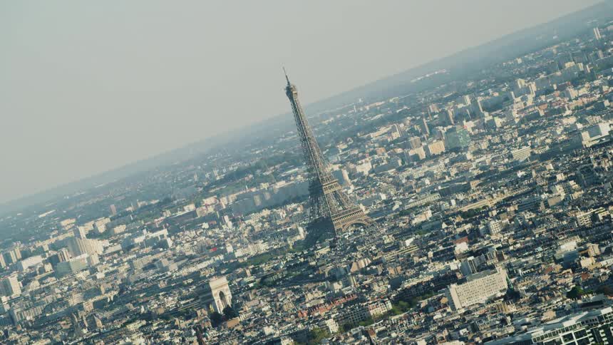 The eiffel tower stands in the city skyline