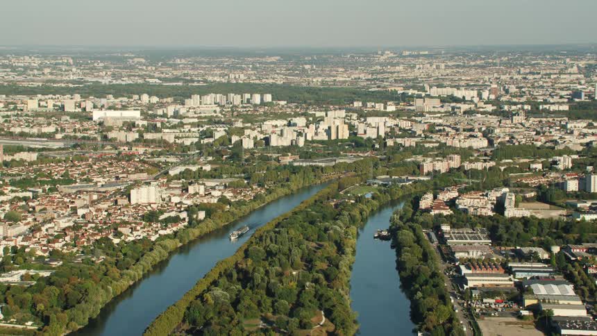 A ferry boat travels down the city canal