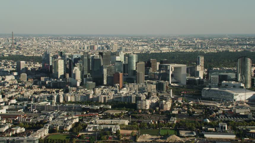 The tall buildings are in the center of the city