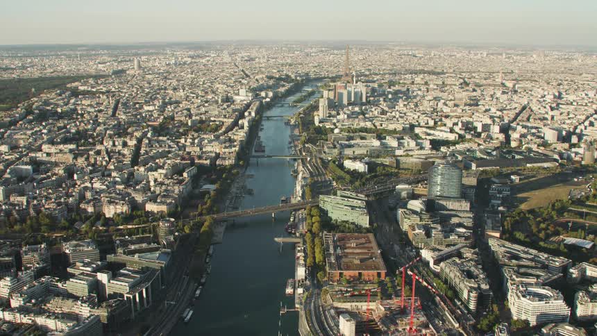 A river crossed by bridges in a dense city