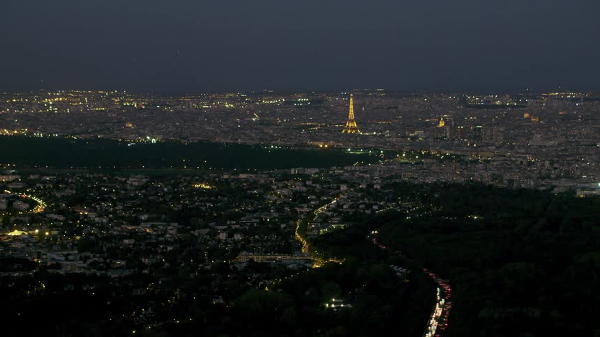 The eiffel tower is illuminated at night
