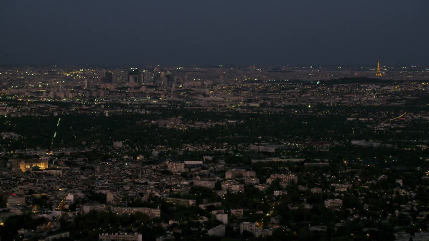 City buildings glow in the night