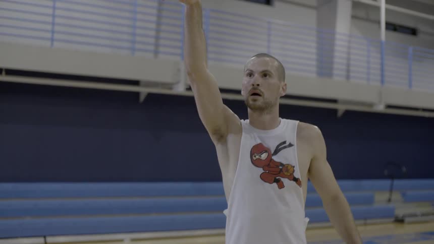 Man takes a basketball shot