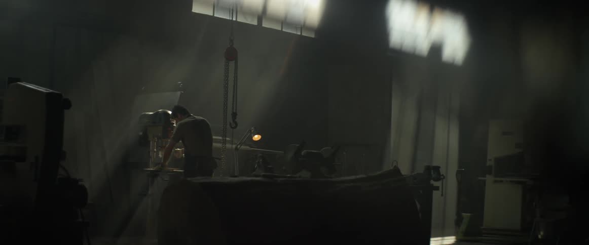 A man works in a wood workshop