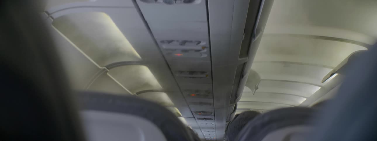 Mist floats in an airplane cabin