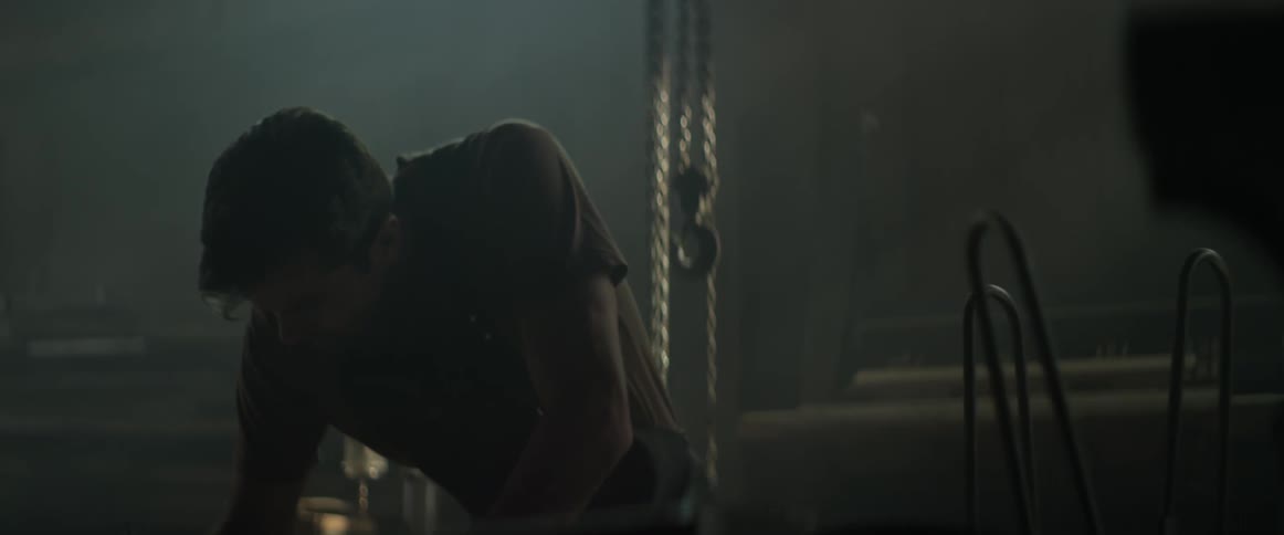 A man is working in a dark shop