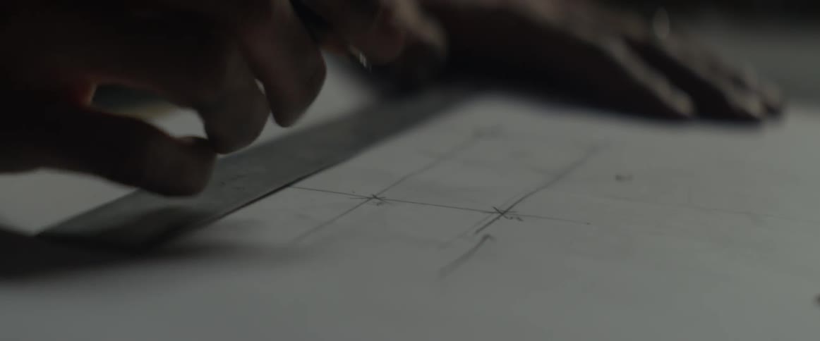 Someone is using a pencil to mark down measurements