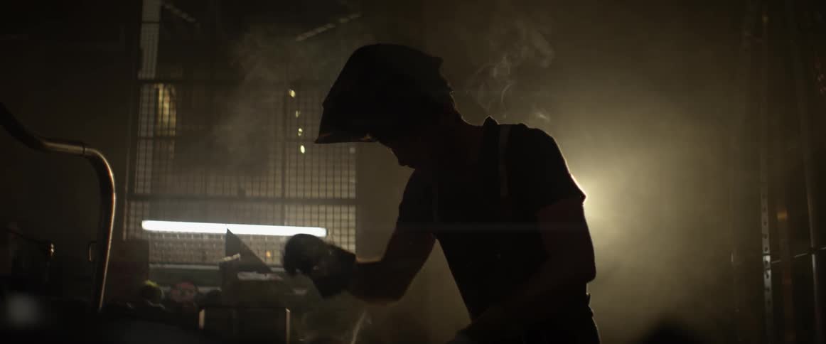 A man welds in a workshop