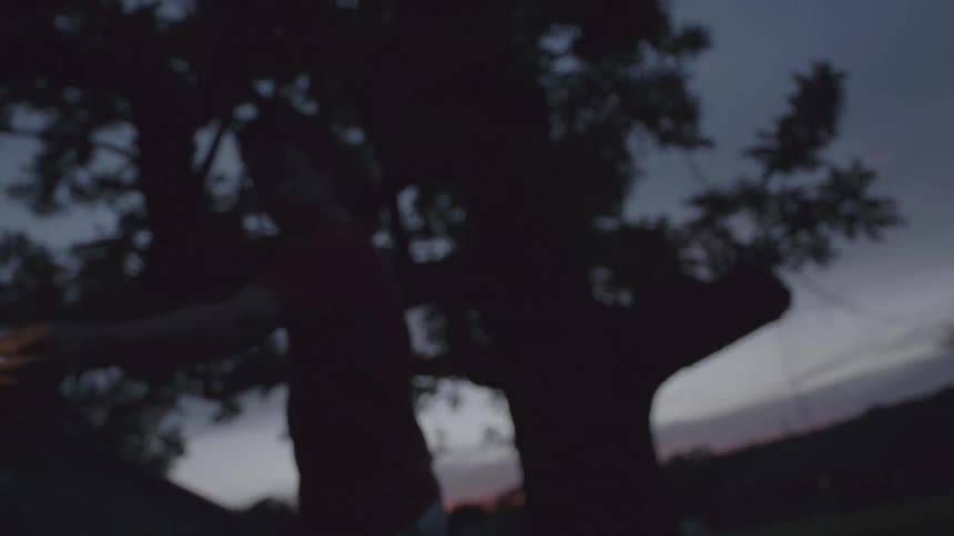 A person twirling with sparklers